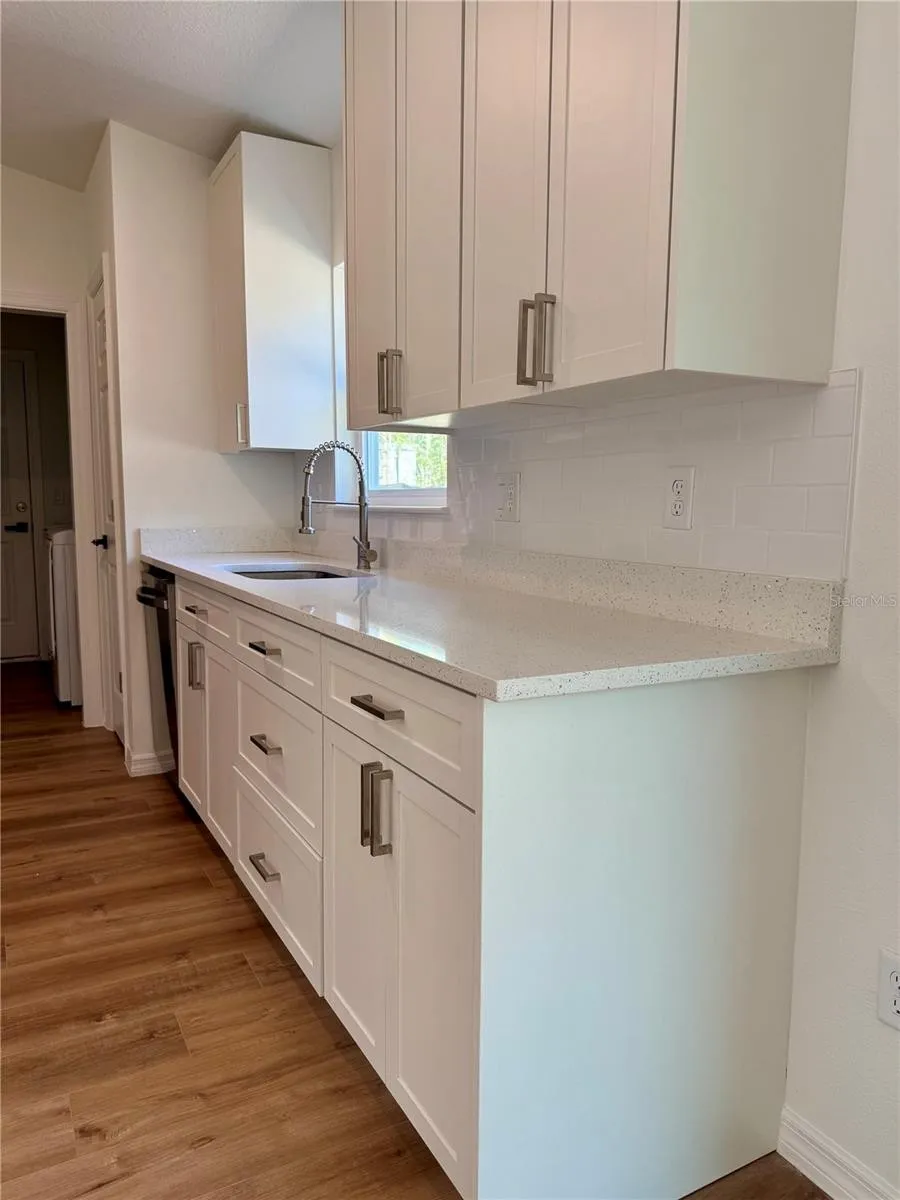 Refined kitchen with custom cabinetry