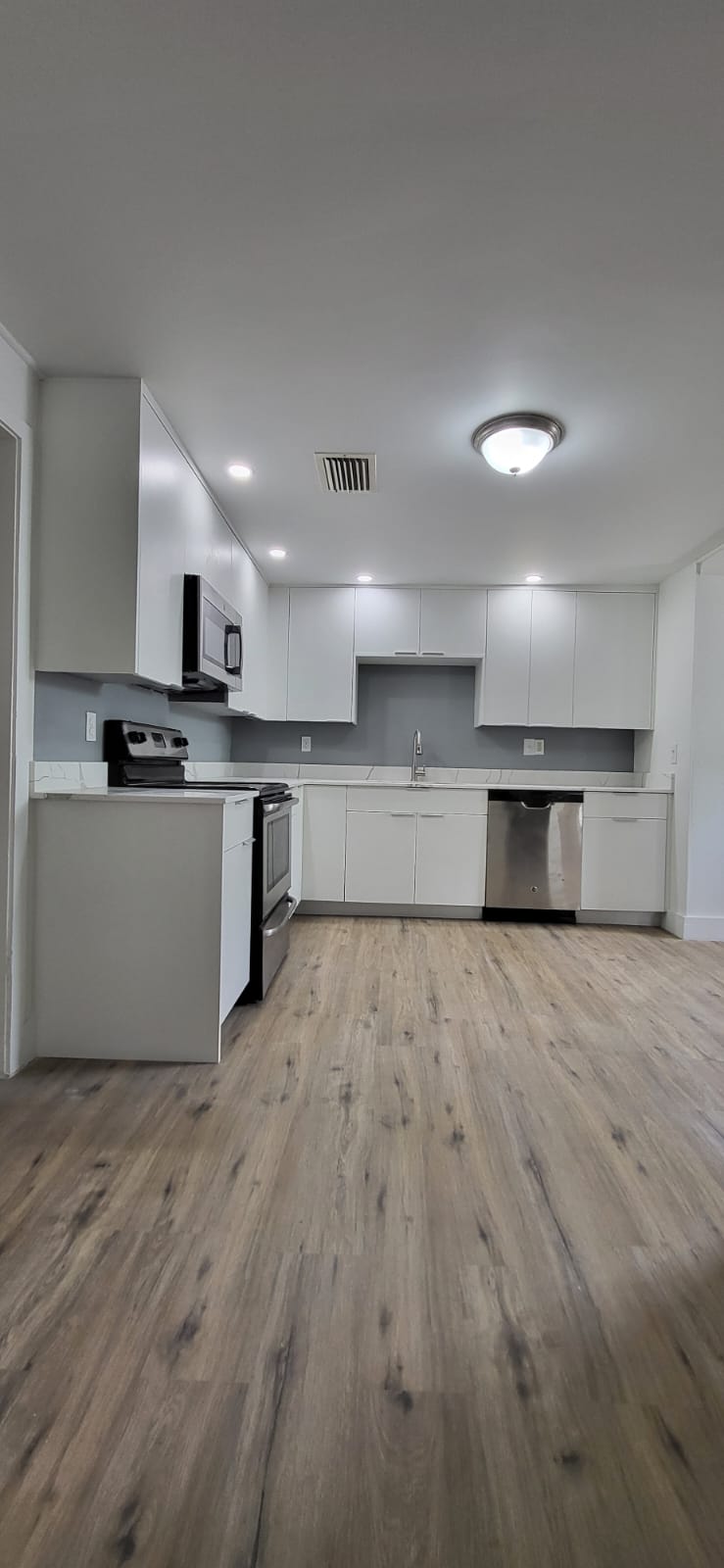 Refined kitchen with custom cabinetry